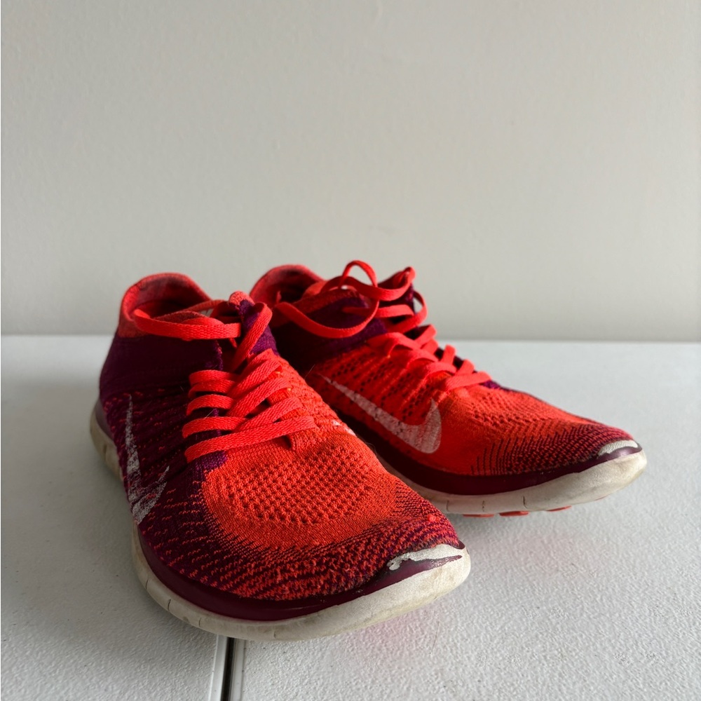 Red and Purple Nike Flyknit Shoes